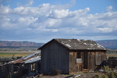 Houses against cloudy sky