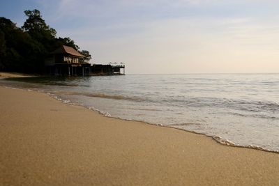 Scenic view of beach against sky during sunset