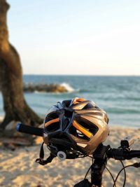 Coin-operated binoculars at beach against clear sky