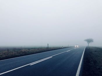 Road against sky during foggy weather