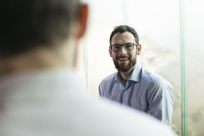 Two businessmen having a meeting in office