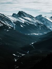 High angle view of snowcapped mountains against sky