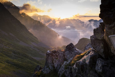 Scenic view of mountains against sky during sunset