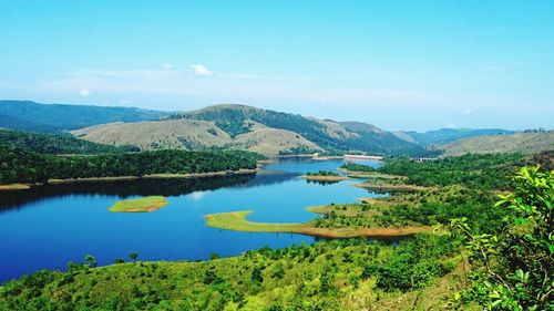 Scenic view of lake against blue sky