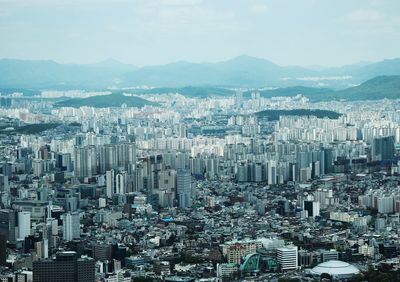 High angle view of buildings in city against sky