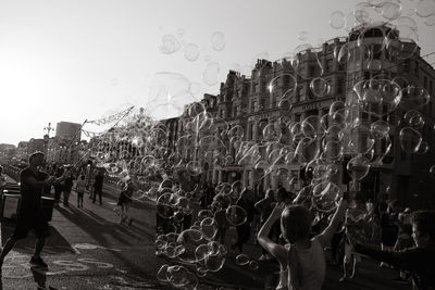 People in city against clear sky