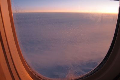 Scenic view of sea seen through airplane window