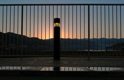 Chainlink fence at sunset