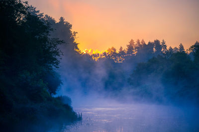 A beautiful spring river landscape with morning fog.