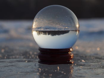 Close-up of water in container at sunset