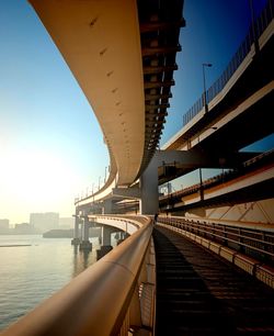 Bridge over river with buildings in background