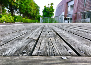 Surface level shot of floorboard by building