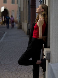 Young woman standing on street