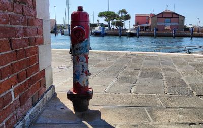 Footpath by building against sky