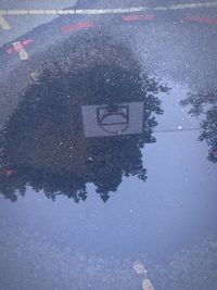 High angle view of puddle on road