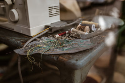 Close-up of rope tied up on table