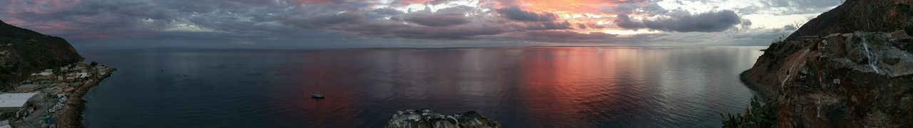 Panoramic view of sea against sky during sunset