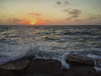 Scenic view of sea against sky during sunset