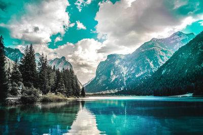 Scenic view of lake and mountains against sky