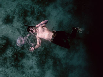 High angle view of man swimming in sea