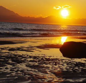 Scenic view of sea against sky during sunset
