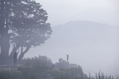 Scenic view of mountain against cloudy sky