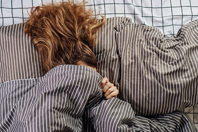 Midsection of woman resting at home