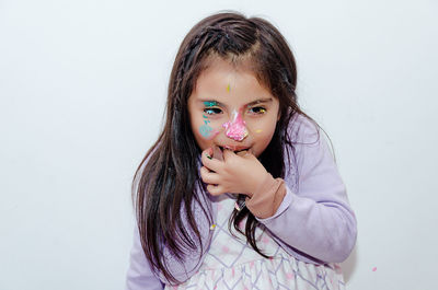 Portrait of a smiling girl over white background