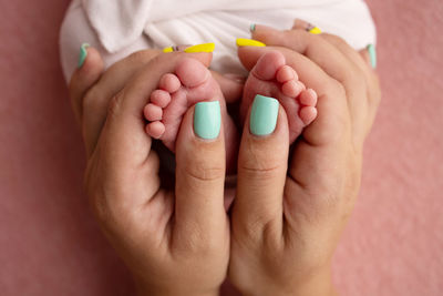 Cropped hand of woman holding pills