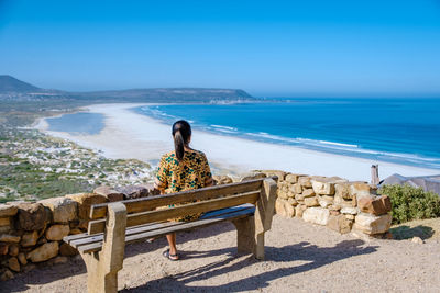 Rear view of woman looking at sea