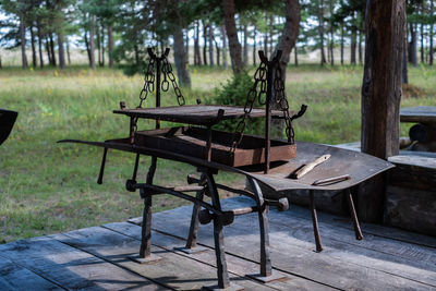 Empty chairs and tables in park