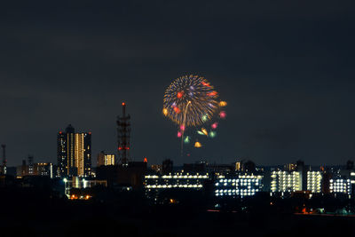 Low angle view of illuminated ferris wheel at night