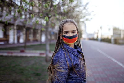 Portrait of girl standing on street