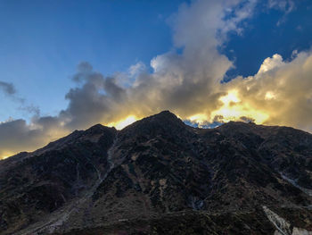 Scenic view of mountains against sky during sunset