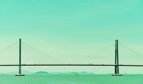 View of suspension bridge over sea