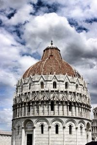 Low angle view of building against cloudy sky
