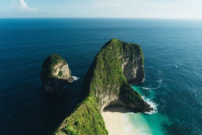 Scenic view of sea against rocks