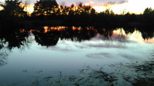 Scenic view of lake at sunset