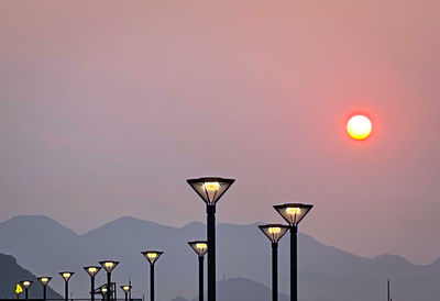 Street light against sky during sunset
