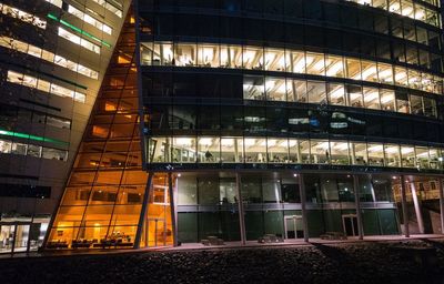 Low angle view of modern building at night