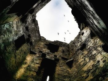 Low angle view of old building against sky