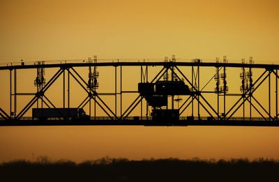 Silhouette of bridge against sky during sunset