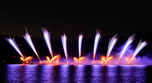 Firework display at night