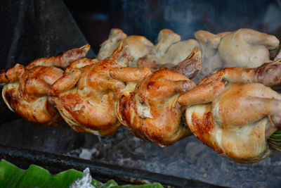 High angle view of meat on barbecue grill