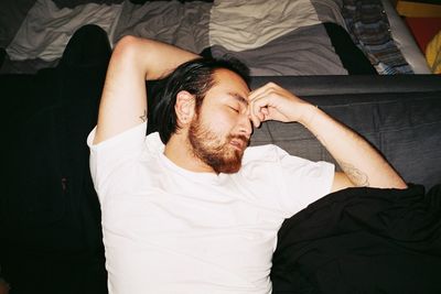 Portrait of a man relaxing on bed