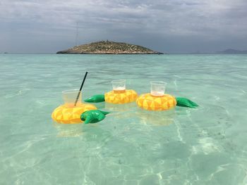 View of swimming pool in sea against sky