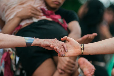 Close-up of people hands