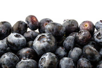 Full frame shot of blueberries against white background