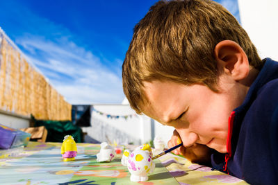 Portrait of boy looking at table