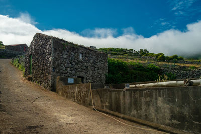 Old building against cloudy sky